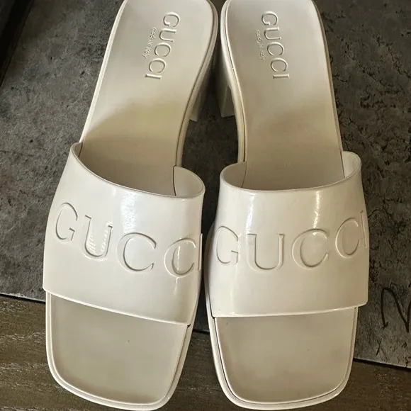 Gucci Cream Mules with Embossed Logo